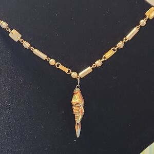 Vintage Chinese gilded orange enamel articulated fish pend with shell necklace.